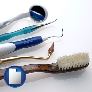 a toothbrush, dental picks, and a mouth mirror - with Utah icon