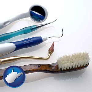 a toothbrush, dental picks, and a mouth mirror - with West Virginia icon
